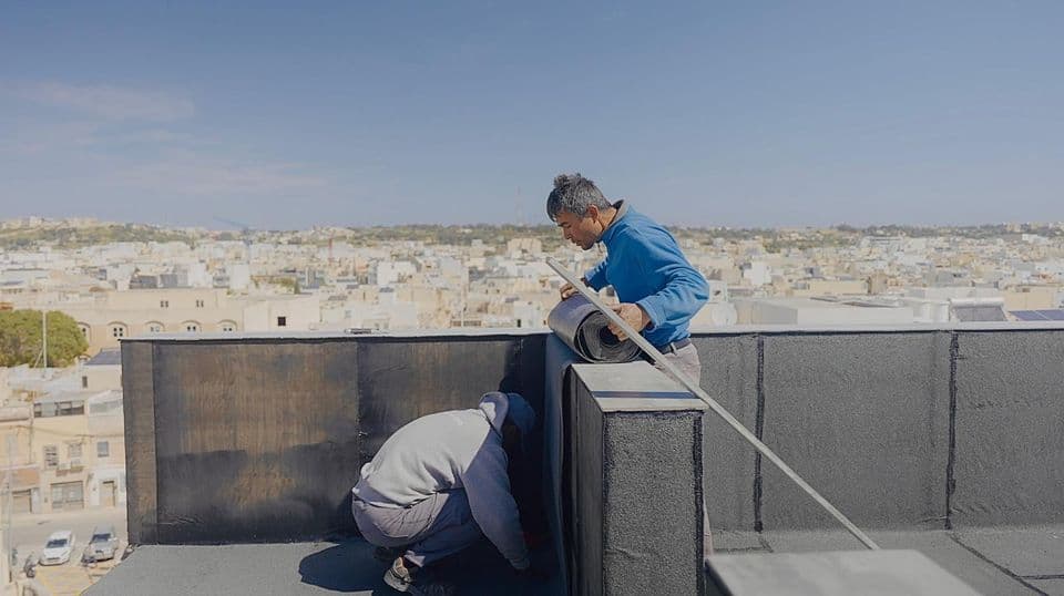Applying liquid waterproofing membrane on a Maltese roof
