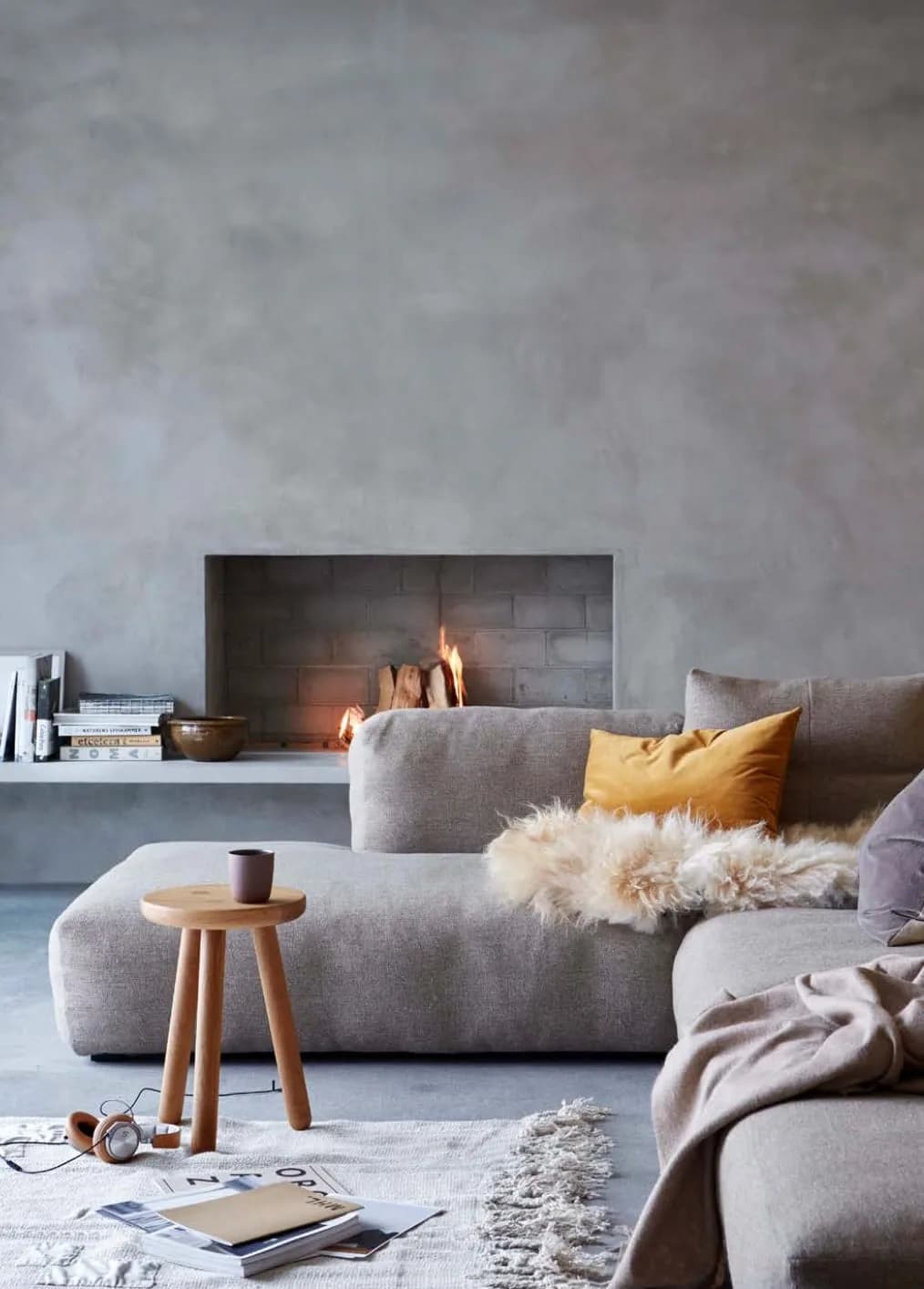 Living room with micro cement walls and fireplace