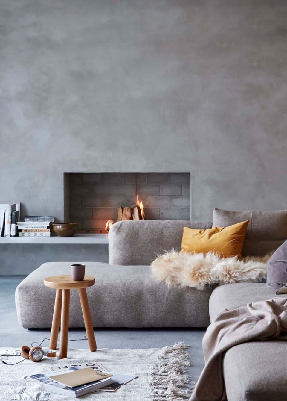 Living room with micro cement walls and fireplace